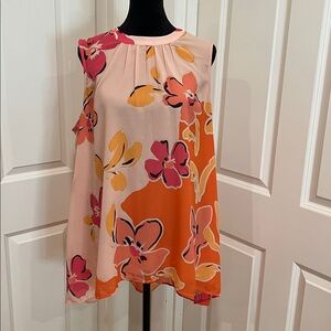 DR2, woman’s, sleeveless, high-low, floral patterned, blouse. Size large.
